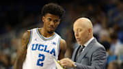 Nov 3, 2025; Los Angeles, California, USA;  UCLA Bruins head coach Mick Cronin talks to guard Donovan Dent (2) during the second half against the Eastern Washington Eagles at Pauley Pavilion presented by Wescom Financial. Mandatory Credit: Kiyoshi Mio-Imagn Images