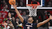 Jan 18, 2025; Louisville, Kentucky, USA;  Virginia Cavaliers forward Jacob Cofie (5) foul Louisville Cardinals guard Terrence Edwards Jr. (5) while blocking his shot during the first half at KFC Yum! Center. Mandatory Credit: Jamie Rhodes-Imagn Images