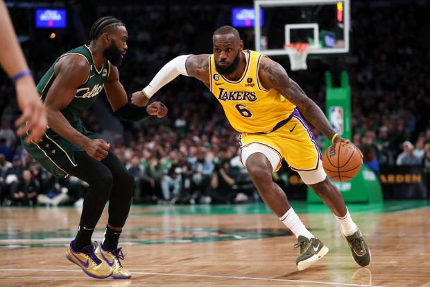 Los Angeles Lakers forward LeBron James (6) drives to the basket defended by Boston Celtics forward Jaylen Brown (7).