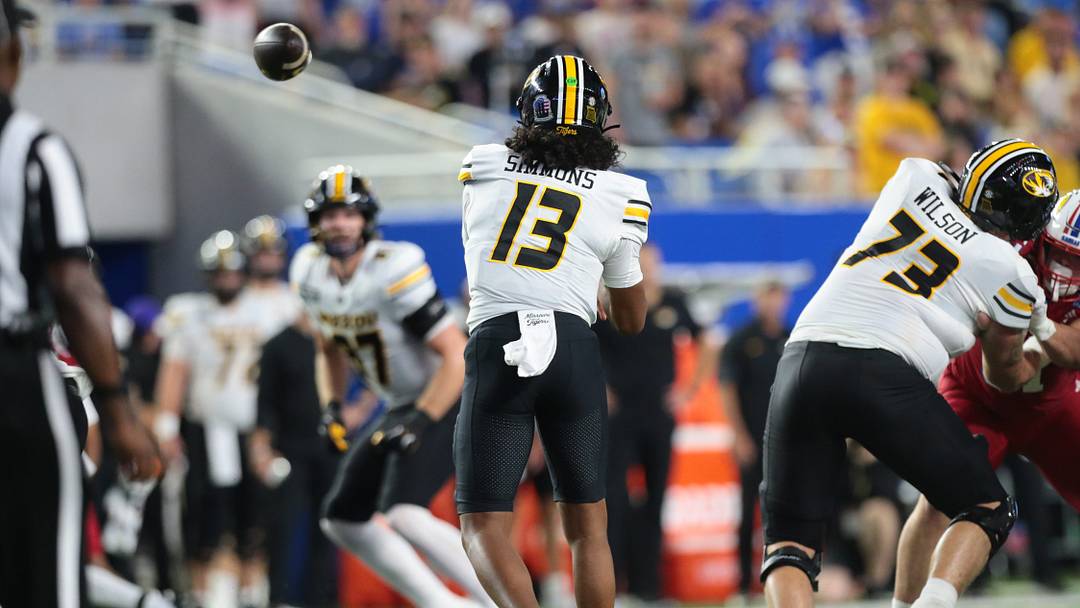 Missouri Tigers quarterback Austin Simmons (13) throws the ball against Kansas Jayhawks during the game inside David Booth Kansas Memorial Stadium on Sept. 11, 2026. Missouri Tigers quarterback Austin Simmons (13) throws the ball against Kansas Jayhawks during the game inside David Booth Kansas Memorial Stadium on Sept. 11, 2026.