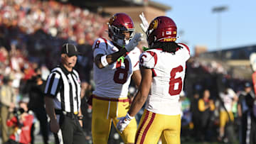 Oct 19, 2024; College Park, Maryland, USA; Southern California Trojans wide receiver Ja'Kobi Lane (8) celebrates with  Trojans wide receiver Makai Lemon (6) after scoring first half touchdown against the Maryland Terrapins  at SECU Stadium. Mandatory Credit: Tommy Gilligan-Imagn Images