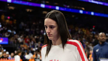 Aug 7, 2025; Phoenix, Arizona, USA; Indiana Fever injured guard Caitlin Clark in attendance against the Phoenix Mercury during an WNBA game at PHX Arena. Mandatory Credit: Mark J. Rebilas-Imagn Images