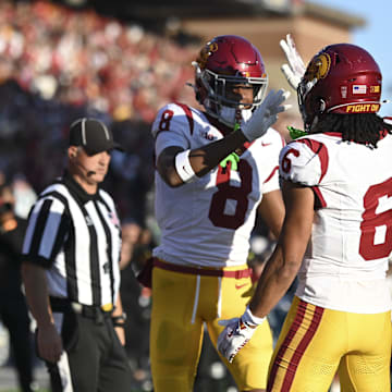 Oct 19, 2024; College Park, Maryland, USA; Southern California Trojans wide receiver Ja'Kobi Lane (8) celebrates with  Trojans wide receiver Makai Lemon (6) after scoring first half touchdown against the Maryland Terrapins  at SECU Stadium. Mandatory Credit: Tommy Gilligan-Imagn Images