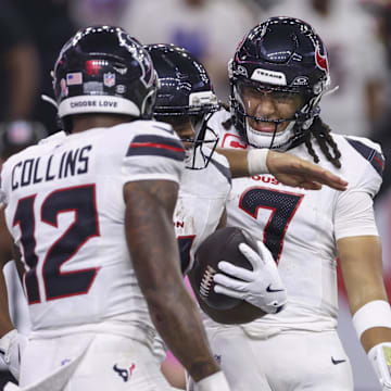 Sep 15, 2025; Houston, Texas, USA; Houston Texans quarterback C.J. Stroud (7) celebrates with running back Nick Chubb (21) after Chubb scores a touchdown during the fourth quarter against the Tampa Bay Buccaneers at NRG Stadium. Mandatory Credit: Troy Taormina-Imagn Images