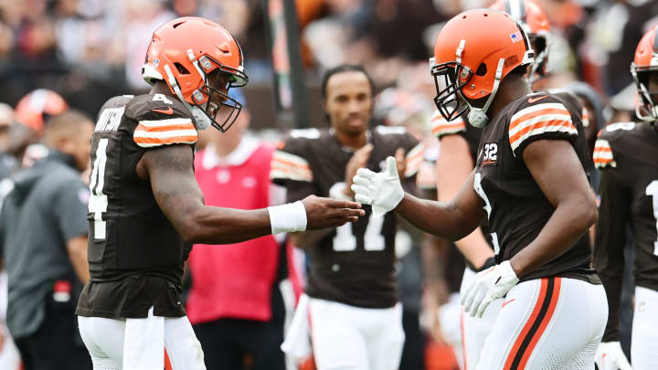 Sep 24, 2023; Cleveland, Ohio, USA; Cleveland Browns quarterback Deshaun Watson (4) celebrates with wide receiver Amari Cooper (2) after they connected on a touchdown pass during the second half against the Tennessee Titans at Cleveland Browns Stadium. Mandatory Credit: Ken Blaze-USA TODAY Sports