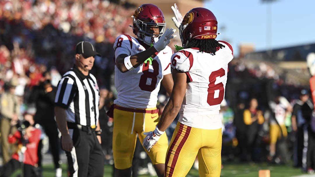 Oct 19, 2024; College Park, Maryland, USA; Southern California Trojans wide receiver Ja'Kobi Lane (8) celebrates with  Trojans wide receiver Makai Lemon (6) after scoring first half touchdown against the Maryland Terrapins  at SECU Stadium. Mandatory Credit: Tommy Gilligan-Imagn Images