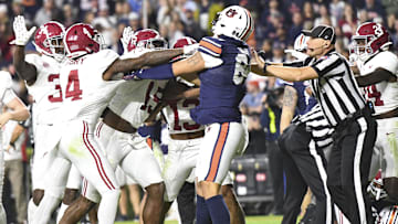 Nov 25, 2023; Auburn, Alabama, USA; Players from the Alabama Crimson Tide and Auburn Tigers get into a shoving match late in a game at Jordan-Hare Stadium. Alabama won 27-24. Mandatory Credit: Gary Cosby Jr.-Imagn Images