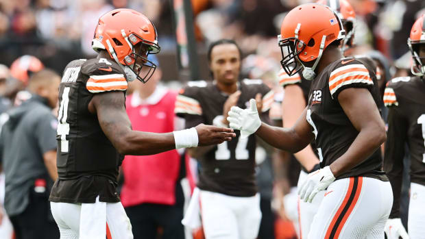 Quarterback and wide receiver celebrate after a touchdown.