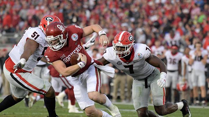 Jan 1, 2018; Pasadena, CA, USA; Oklahoma Sooners quarterback Baker Mayfield (6) is sacked by Georgia Bulldogs linebacker Lorenzo Carter (7) the 2018 Rose Bowl college football playoff semifinal game at Rose Bowl Stadium. Georgia defeated Oklahoma 54-48 in two overtimes. Mandatory Credit: Kirby Lee-Imagn Images