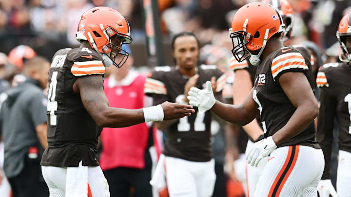 Sep 24, 2023; Cleveland, Ohio, USA; Cleveland Browns quarterback Deshaun Watson (4) celebrates with wide receiver Amari Cooper (2) after they connected on a touchdown pass during the second half against the Tennessee Titans at Cleveland Browns Stadium.