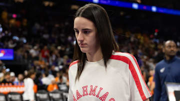 Aug 7, 2025; Phoenix, Arizona, USA; Indiana Fever injured guard Caitlin Clark in attendance against the Phoenix Mercury during an WNBA game at PHX Arena. Mandatory Credit: Mark J. Rebilas-Imagn Images