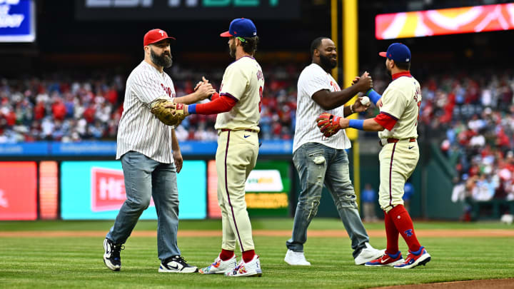 Mar 30, 2024; Philadelphia, Pennsylvania, USA; Former Philadelphia Eagles Jason Kelce and Fletcher Cox greet Philadelphia Phillies first baseman Bryce Harper (3) and designated hitter Kyle Schwarber (12) before the game against the Atlanta Braves at Citizens Bank Park. Kyle Ross-USA TODAY Sports