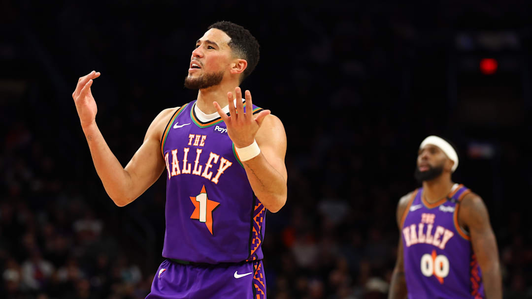 Phoenix Suns guard Devin Booker reacts against the Charlotte Hornets.