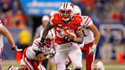 Montee Ball (28) scores a touchdown getting past Nebraska's Andrew Green (11) during the second half as the University of Wisconsin earned a 70-31 win over Nebraska in the 2012 Big Ten Championship football game at Lucas Oil Stadium in Indianapolis, Indiana on December 1, 2012.