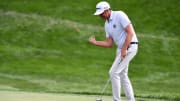 Aug 24, 2024; Castle Rock, Colorado, USA; Keegan Bradley celebrates after putting in for birdie on the 18th hole during the third round of the BMW Championship golf tournament at Castle Pines Golf Club. Mandatory Credit: Christopher Hanewinckel-USA TODAY Sports