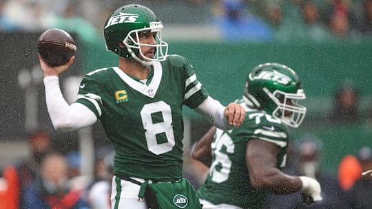 Sep 29, 2024; East Rutherford, New Jersey, USA; New York Jets quarterback Aaron Rodgers (8) passes the ball during the first half against the New York Jets at MetLife Stadium. Mandatory Credit: Vincent Carchietta-Imagn Images