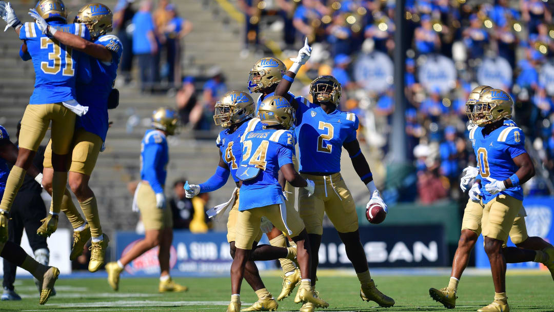 Oct 7, 2023; Pasadena, California, USA; UCLA Bruins linebacker Oluwafemi Oladejo (2) celebrates after intercepting a pass against the Washington State Cougars during the second half at Rose Bowl. Mandatory Credit: Gary A. Vasquez-USA TODAY Sports