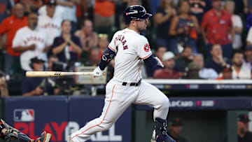 Oct 1, 2024; Houston, Texas, USA; Houston Astros third base Alex Bregman (2) hits a single against the Detroit Tigers in the ninth inning  in game one of the Wild Card round for the 2024 MLB Playoffs at Minute Maid Park.