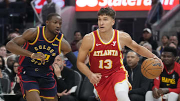 November 20, 2024; San Francisco, California, USA; Atlanta Hawks guard Bogdan Bogdanovic (13) dribbles the basketball against Golden State Warriors forward Jonathan Kuminga (00) during the first quarter at Chase Center. Mandatory Credit: Kyle Terada-Imagn Images