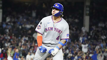 Sep 23, 2025; Chicago, Illinois, USA; New York Mets catcher Francisco Alvarez (4) gestures to the dugout after hitting a two-run home run against the Chicago Cubs during the eighth inning at Wrigley Field. Mandatory Credit: David Banks-Imagn Images