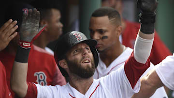 Sep 14, 2017; Boston, MA, USA; Boston Red Sox second baseman Dustin Pedroia (15) high fives his