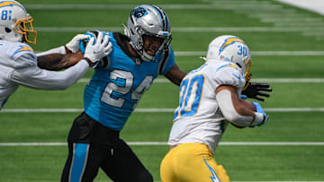 Sep 27, 2020; Inglewood, California, USA;  Carolina Panthers cornerback Rasul Douglas (24) runs down Los Angeles Chargers running back Austin Ekeler (30) during the second half at SoFi Stadium. Mandatory Credit: Robert Hanashiro-Imagn Images