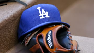 Aug 16, 2019; Atlanta, GA, USA; Detailed view of Los Angeles Dodgers hat and glove in the dugout against the Atlanta Braves in the first inning at SunTrust Park. Mandatory Credit: Brett Davis-Imagn Images