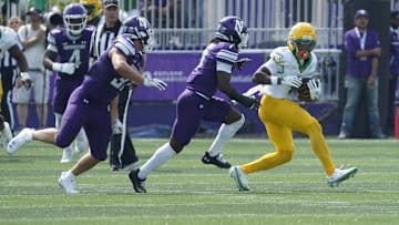 Sep 13, 2025; Evanston, Illinois, USA; Oregon Ducks wide receiver Dakorien Moore (1) catches a pass against the Northwestern Wildcats during the first half at Northwestern Medicine Field at Martin Stadium. Mandatory Credit: David Banks-Imagn Images