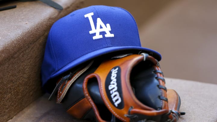 Aug 16, 2019; Atlanta, GA, USA; Detailed view of Los Angeles Dodgers hat and glove in the dugout against the Atlanta Braves in the first inning at SunTrust Park. Mandatory Credit: Brett Davis-USA TODAY Sports