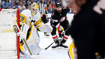 Jan 17, 2025; Buffalo, New York, USA;  Pittsburgh Penguins goaltender Alex Nedeljkovic (39) and Buffalo Sabres right wing Alex Tuch (89) look for the puck during the second period at KeyBank Center. Mandatory Credit: Timothy T. Ludwig-Imagn Images