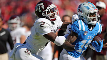 Nov 4, 2023; Oxford, Mississippi, USA; Mississippi Rebels wide receiver Dayton Wade (19) runs after a catch as Texas A&M Aggies defensive back Jacoby Mathews (2) knocks him out of bounds during the first half at Vaught-Hemingway Stadium. Mandatory Credit: Petre Thomas-Imagn Images