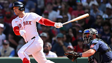Apr 24, 2025; Boston, Massachusetts, USA; Boston Red Sox third base Alex Bregman (2) hits a RBI single against the Seattle Mariners during the third inning at Fenway Park. Mandatory Credit: Brian Fluharty-Imagn Images