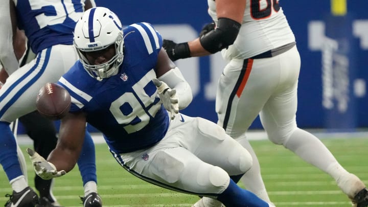 Indianapolis Colts defensive tackle Adetomiwa Adebawore (95) attempts and fails to recover a ball during the first half of a preseason game against the Denver Broncos on Sunday, Aug. 11, 2024, at Lucas Oil Stadium in Indianapolis. The Broncos defeated the Colts 34-30.