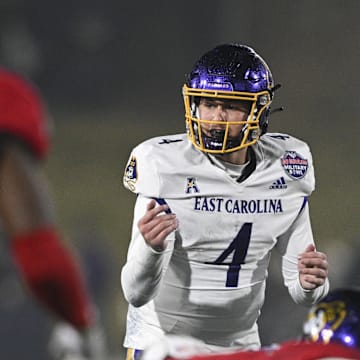 Dec 28, 2024; Annapolis, MD, USA;  East Carolina Pirates quarterback Katin Houser (4) calls a play act the line during first half of the Go Bowling Military Bowl against the North Carolina State Wolfpack at Navy-Marine Corps Memorial Stadium. Mandatory Credit: Tommy Gilligan-Imagn Images