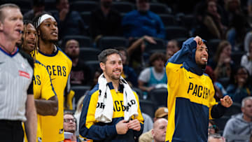 Oct 17, 2024; Indianapolis, Indiana, USA; Indiana Pacers guard Tyrese Haliburton (0) guard T.J. McConnell (9) and center Myles Turner (33) cheer from the bench  in the second half against the Charlotte Hornets at Gainbridge Fieldhouse. Mandatory Credit: Trevor Ruszkowski-Imagn Images