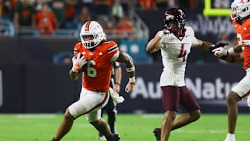 Sep 27, 2024; Miami Gardens, Florida, USA; Miami Hurricanes running back Damien Martinez (6) runs with the football against the Virginia Tech Hokies during the fourth quarter at Hard Rock Stadium. Mandatory Credit: Sam Navarro-Imagn Images