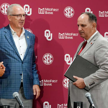 SEC commissioner Greg Sankey, center, talks with OU President Joseph Harroz Jr., left, and OU athletic director Joe Castiglione after a press conference before a celebration for OU joining the Southeastern Conference in Norman, Okla., Monday, July 1, 2024.