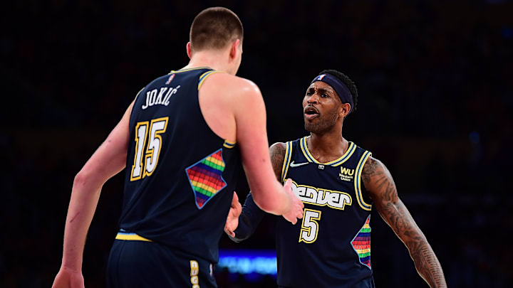 Apr 3, 2022; Los Angeles, California, USA; Denver Nuggets forward Will Barton (5) reacts with center Nikola Jokic (15) against the Los Angeles Lakers during the second half at Crypto.com Arena. Mandatory Credit: Gary A. Vasquez-Imagn Images