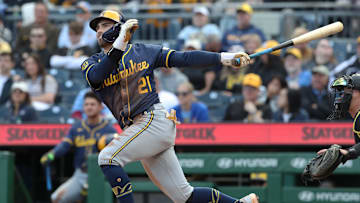 May 24, 2025; Pittsburgh, Pennsylvania, USA;  Milwaukee Brewers third baseman Caleb Durbin (21) hits a single against the Pittsburgh Pirates during the seventh inning at PNC Park. Mandatory Credit: Charles LeClaire-Imagn Images