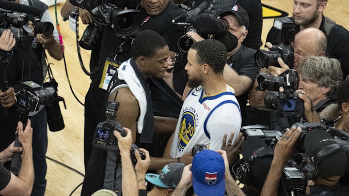 April 30, 2023; Sacramento, California, USA; Golden State Warriors guard Stephen Curry (30) hugs Sacramento Kings guard De'Aaron Fox (5) after game seven of the 2023 NBA playoffs first round at Golden 1 Center. Mandatory Credit: Kyle Terada-Imagn Images