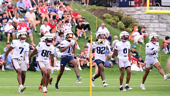 Jul 24, 2024; Foxborough, MA, USA; New England Patriots wide receiver JuJu Smith-Schuster (7), wide receiver Kayshon Boutte (80), wide receiver Tyquan Thornton (11), wide receiver JaQuae Jackson (82), wide receiver Javon Baker (6), and wide receiver Kawaan Baker (86) work on drills during training camp at Gillette Stadium. Mandatory Credit: Eric Canha-USA TODAY Sports