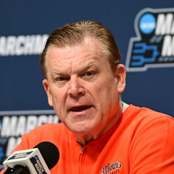 Mar 20, 2025; Milwaukee, WI, USA;  Illinois Fighting Illini head coach Brad Underwood speaks at press conference during NCAA Tournament First Round Practice at Fiserv Forum. Mandatory Credit: Benny Sieu-Imagn Images