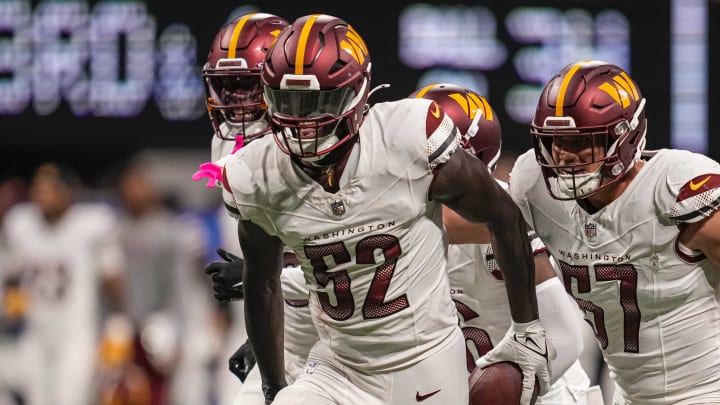 Oct 15, 2023; Atlanta, Georgia, USA; Washington Commanders linebacker Jamin Davis (52) reacts with teammates after intercepting a pass against the Atlanta Falcons during the fourth quarter at Mercedes-Benz Stadium. Mandatory Credit: Dale Zanine-USA TODAY Sports