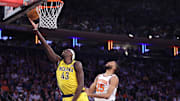 Pacers forward Siakam shoots while under pressure from Knicks forward Bridges during Game 2 of the Eastern Conference Finals.