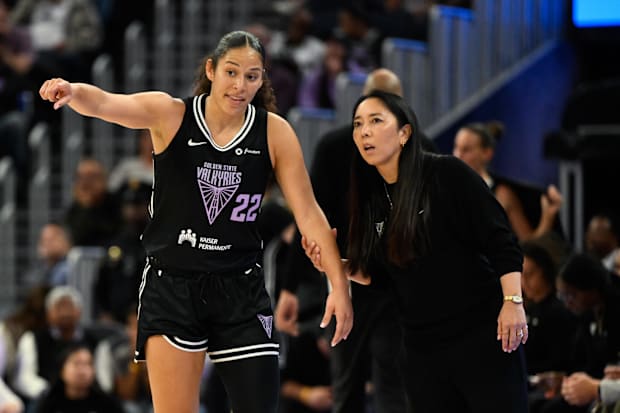Golden State Valkyries head coach Natalie Nakase talks to guard Veronica Burton (22) 