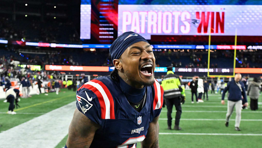 New England Patriots wide receiver Stefon Diggs (8) reacts after defeating the Los Angeles Chargers in an AFC Wild Card Round game at Gillette Stadium.