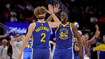 Nov 2, 2024; Houston, Texas, USA; Golden State Warriors forward Draymond Green (23) congratulates guard Brandin Podziemski (2) after a basket against the Houston Rockets during the second quarter at Toyota Center. Mandatory Credit: Erik Williams-Imagn Images
