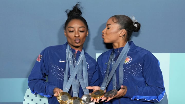 Simone Biles and Jordan Chiles of the United States pose for a photo with their medals from the 2024 Olympic Games in Paris.