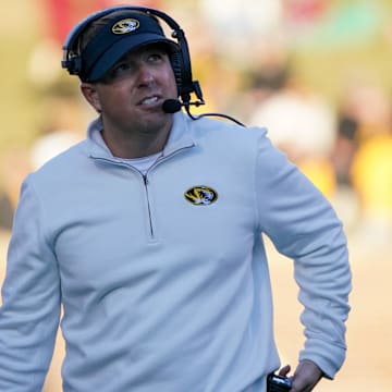 Nov 25, 2022; Columbia, Missouri, USA; Missouri Tigers head coach Eli Drinkwitz watches play against the Arkansas Razorbacks during the first half at Faurot Field at Memorial Stadium. Mandatory Credit: Denny Medley-Imagn Images