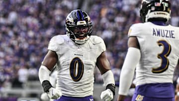 Nov 9, 2025; Minneapolis, Minnesota, USA; Baltimore Ravens linebacker Roquan Smith (0) reacts with cornerback Chidobe Awuzie (3) during the third quarter against the Minnesota Vikings at U.S. Bank Stadium. Mandatory Credit: Jeffrey Becker-Imagn Images